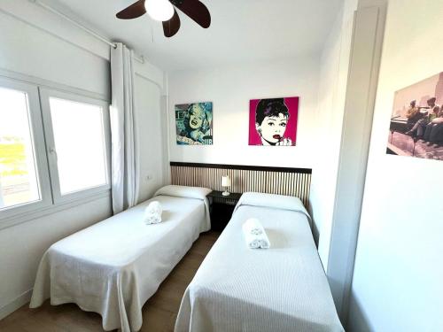 Giường trong phòng chung tại Apartamento Velazquez Aeropuerto A