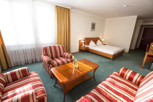 Postel nebo postele na pokoji v ubytování Hotel Exel