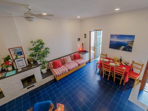 a living room with a couch and a table at Il Baluardo Sea View Apartment on the Cliff in Manarola