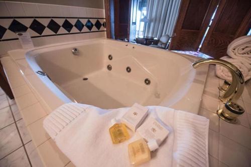 a bath tub with towels and a faucet in a bathroom at The Inn at Dresden in Dresden