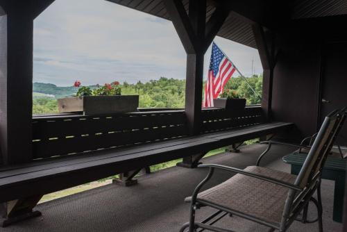 a room with a window with an american flag at The Inn at Dresden in Dresden