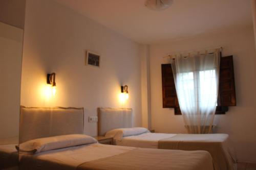 Postel nebo postele na pokoji v ubytování Apartamentos de Astroturismo la Cañada