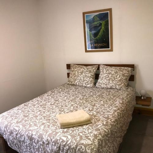 Postel nebo postele na pokoji v ubytování La Kaz Pomme Cannelle