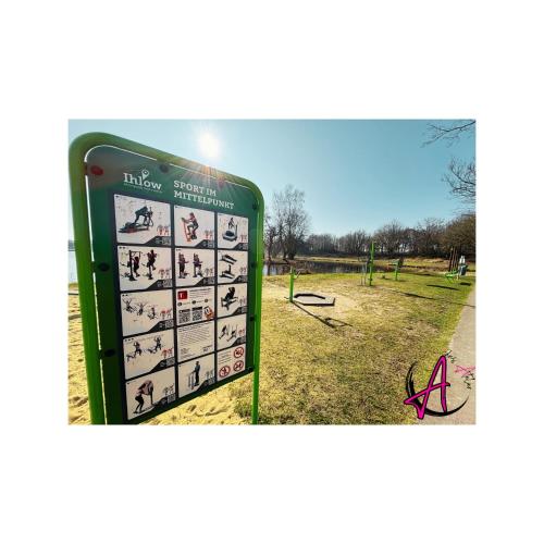 a sign in a park with a bunch of animals on it at Das Atelier in Ihlow