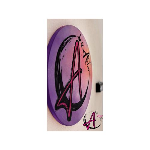 a painting of a anarchy sign on a wall at Das Atelier in Ihlow