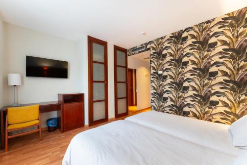 Postel nebo postele na pokoji v ubytování Hotel Doña Urraca