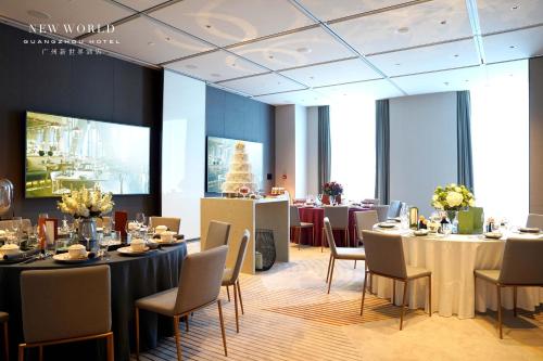 a dining room with tables and chairs in a building at New World Guangzhou Hotel-- FREE Canton Fair Shuttle Bus in Guangzhou