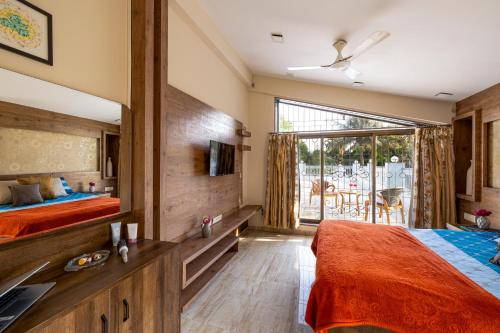 Cama o camas de una habitación en Geeta Bhawan Villa