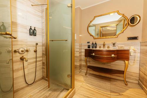 a bathroom with a sink and a mirror at Romance Istanbul Hotel Boutique Class in Istanbul