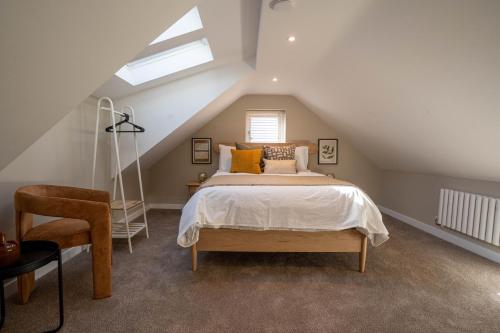 En eller flere senge i et værelse på Coral Cottage