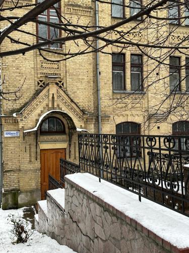 a large brick building with a wooden door at Sikorsky Hotel in Kyiv