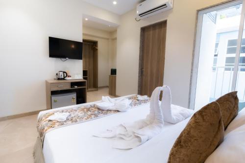 Кровать или кровати в номере Hotel Flora