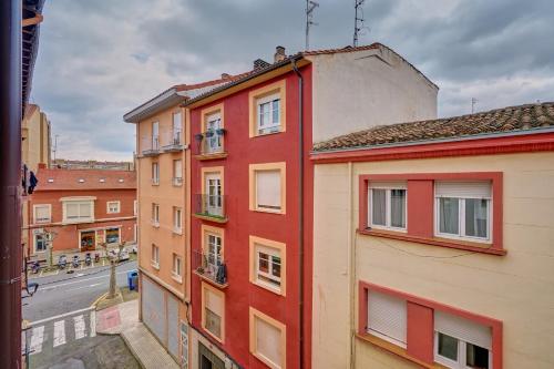 a group of buildings on a city street at Apartamentos Vinomium by Clabao in Logroño