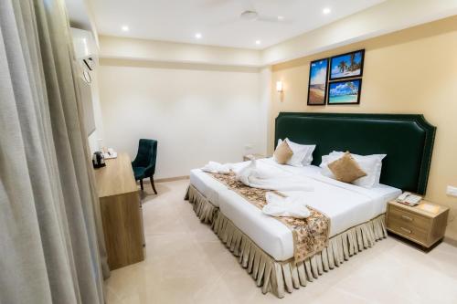 Кровать или кровати в номере Hotel Flora