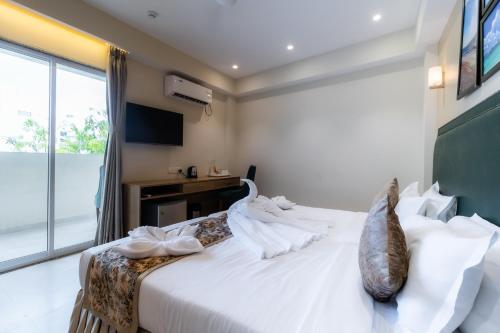 Кровать или кровати в номере Hotel Flora