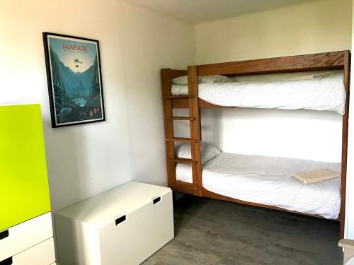 Postel nebo postele na pokoji v ubytování La Kaz Pomme Cannelle