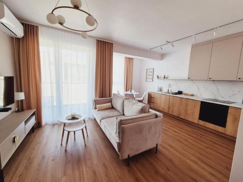 a living room with a couch and a table at Apartament Gniezno Bulwary 7a in Gniezno