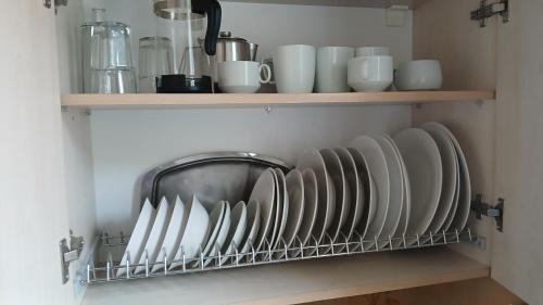 Příslušenství pro přípravu čaje a kávy v ubytování Ipsos apartment