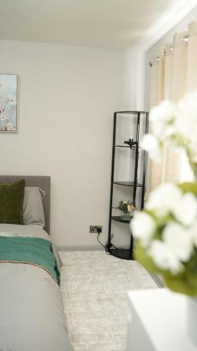 a bedroom with a bed and a book shelf at ODAFRO Properties in Kent