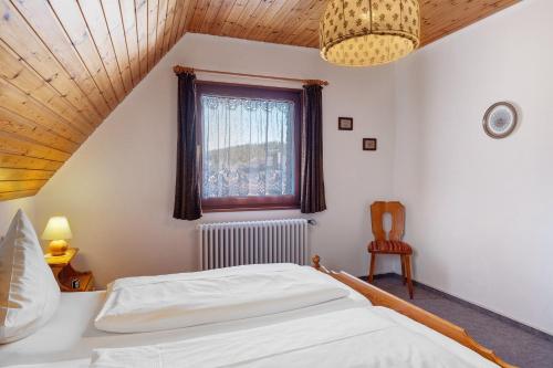 Кровать или кровати в номере Ferienhaus im Grund
