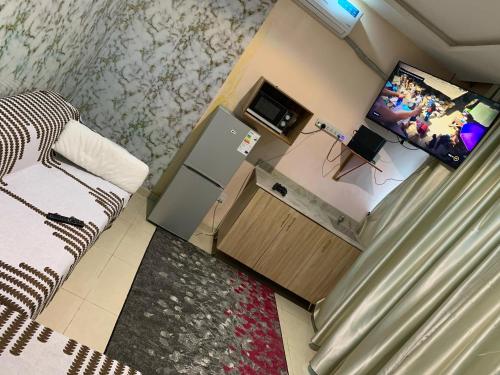 TV a/nebo společenská místnost v ubytování Xplode Residence