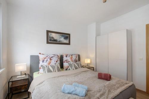 Postel nebo postele na pokoji v ubytování Ferienwohnung San Marino 3