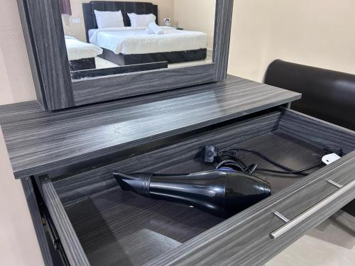 a mirror in a drawer with a blow dryer in it at Tekoma Resort Cameron Highlands in Tanah Rata