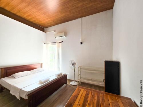 Ένα ή περισσότερα κρεβάτια σε δωμάτιο στο Kandy Green Villa