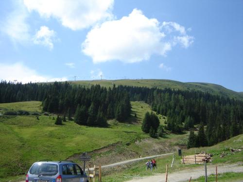 a car parked on a dirt road on a hill at Monarchia Park in Lachtal