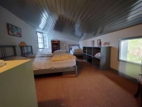 Ένα ή περισσότερα κρεβάτια σε δωμάτιο στο Maison Hameka