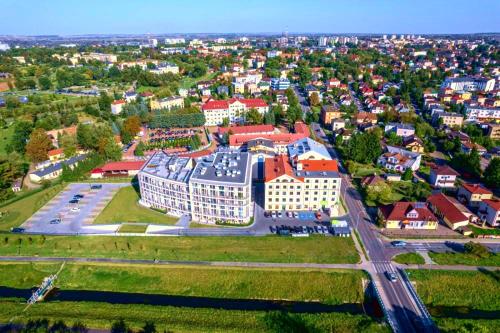 an aerial view of a city with a building at Apartament Stara Elektrownia in Zamość