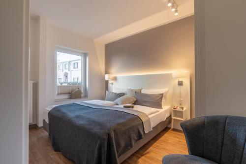 Postel nebo postele na pokoji v ubytování Wittehuus Wohnung 4