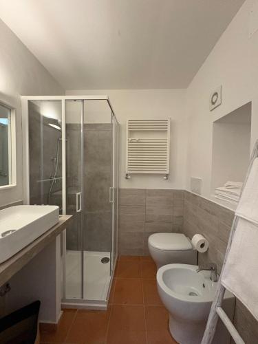 a bathroom with a shower and a toilet and a sink at Tata in Castel Gandolfo