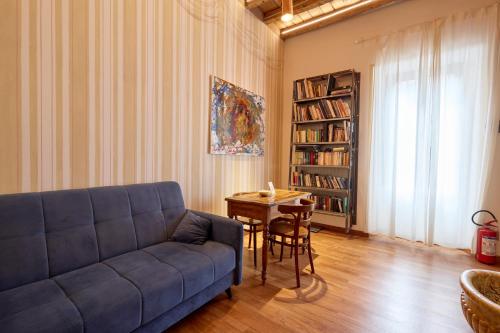 a living room with a couch and a table at Emme Loft I First Moon - Exclusive Design Apartment with balcony in Milan
