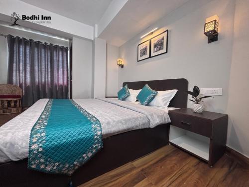Postel nebo postele na pokoji v ubytování Bodhi Inn Homestay