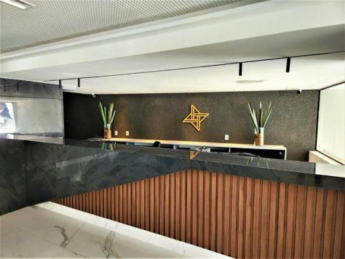 a lobby with a star on the wall at Flat Beira Mar, Arpoar João Pessoa in João Pessoa
