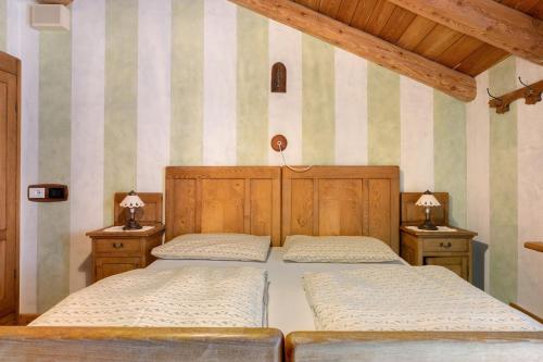 Postel nebo postele na pokoji v ubytování Agriturismo Alpenvidehof