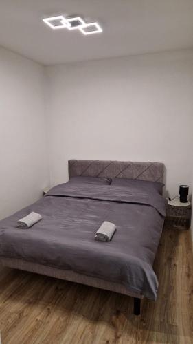 a bed with two pillows on it in a bedroom at Presov Stay Comfort in Prešov