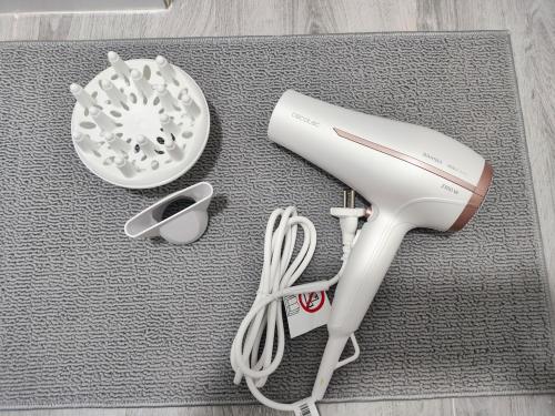 a wii remote and other items on a rug at Santurce A2 Centro Wizink Bernabeu in Madrid
