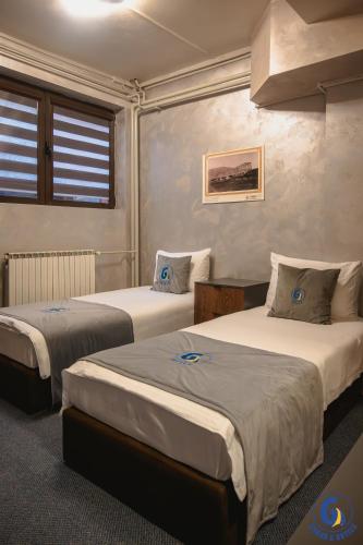 Cama o camas de una habitación en GRAND G by GENERALTURIST GROUP