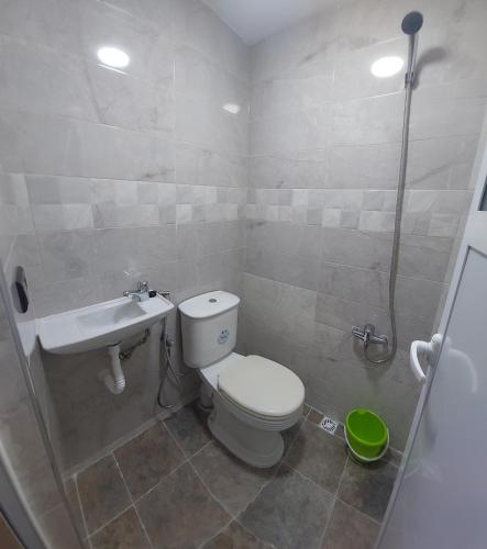 a bathroom with a toilet and a sink at Cozy Room & Modern Amenities 5 in Tetouan