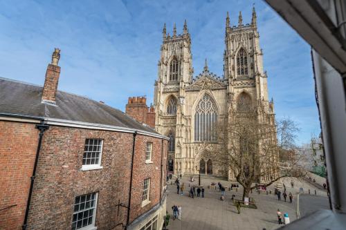 a large cathedral with people walking in front of it at Music House in York