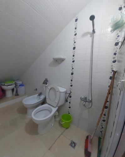 a bathroom with a toilet and a shower at Cozy Room & Modern Amenities 6 in Tetouan