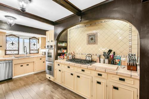a kitchen with wooden cabinets and a stove top oven at 316MAR 316 Marilla in Avalon