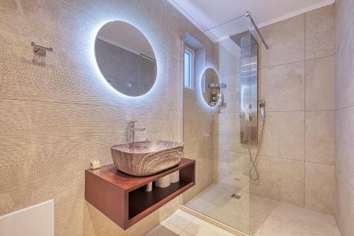 a bathroom with a sink and a shower at Nafplia Castle in Nafplio