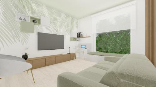 a living room with a couch and a flat screen tv at Club del Sole Stork Family Collection in Giulianova