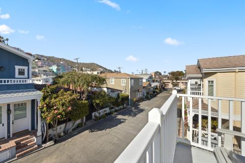 a balcony view of a street with houses at 320E 320 Eucalyptus in Avalon