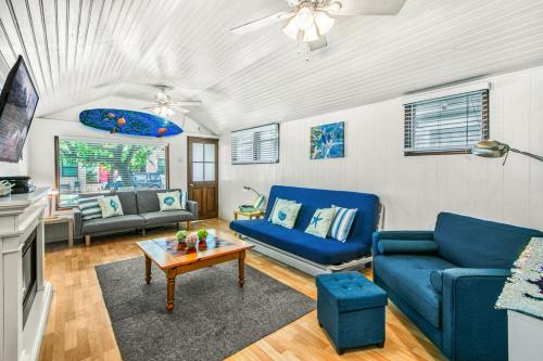 a living room with blue couches and a table at 322S 322 Sumner Ave in Avalon