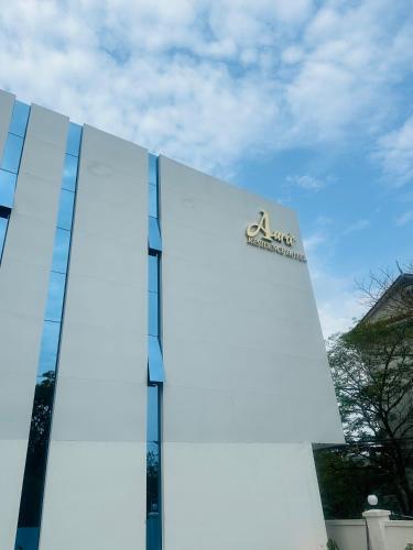 a building with a sign on the side of it at The Aura Residence in Sihanoukville