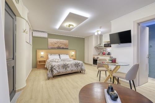 a bedroom with a bed and a table and a kitchen at Nafplia Castle in Nafplio